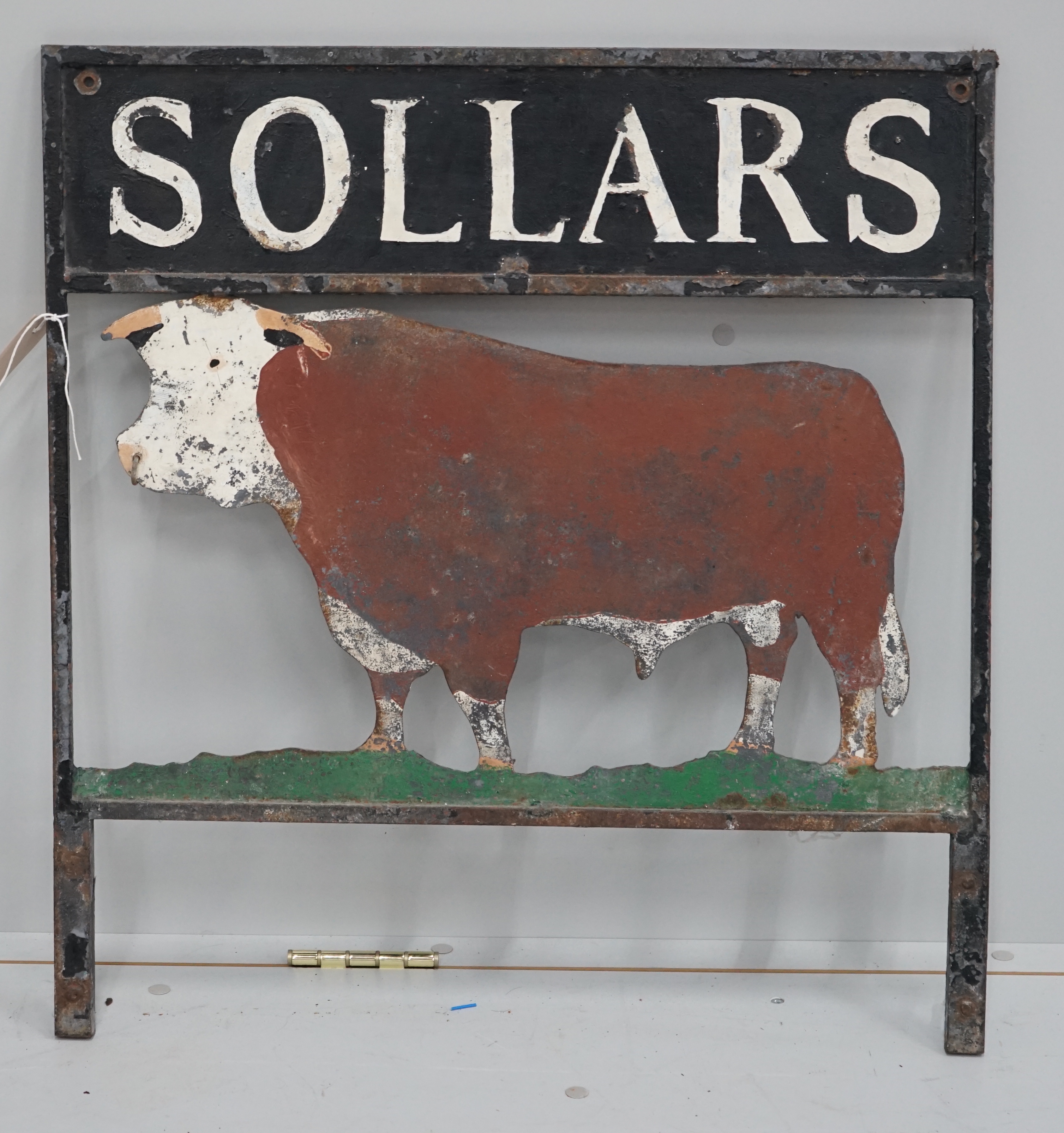 A vintage painted metal sign, 'Sollars', width 64cm, height 53cm